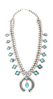 A Navajo Silver and Turquoise Naja Necklace Length 26 inches, naja 2 1/2 inches.