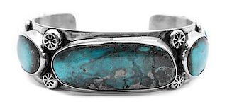 A Navajo Silver and Turquoise Bracelet, Edison Begay Length 5 7/8 x opening 1 1/4 x width 1 inches.