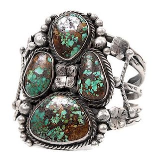 A Southwestern Style Silver and Turquoise Bracelet Length 6 3/4 x opening 1 1/2 x width 3 inches