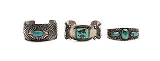Three Navajo Silver and Turquoise Bracelets Length of first 5 1/2 x opening 1 x width 1 3/8 inches.