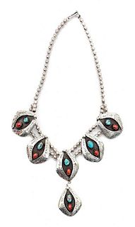 A Navajo Silver, Nevada Turquoise and Coral Necklace Length with drop 11 1/2 inches.
