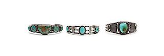 Three Navajo Silver and Turquoise Bracelets Length of first 5 3/4 x opening 1 1/8 x width 3/4 inches.