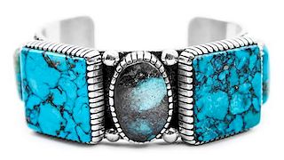 A Navajo Silver and Turquoise Cuff Bracelet, Edison Begay Length 5 7/8 x opening 1 1/8 x width 1 1/8 inches.