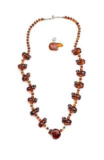 An Amber and Turquoise Heartline Bear Fetish Necklace Length of necklace 32 inches.