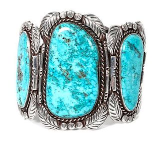 A Navajo Silver and Turquoise Cuff Bracelet Length 5 3/8 x opening 1 x width 2 3/4 inches.