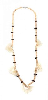 A Heishi, Stone and Shaped Shell Bird Fetish Necklace Length 28 inches.