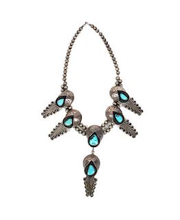 A Southwestern Silver and Turquoise Necklace Length 17 inches.