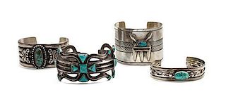 Four Silver and Turquoise Bracelets Length of largest 6 x opening 1 1/8 x width 1 7/8 inches.