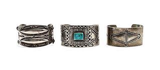 Three Navajo Style Silver Bracelets Length of first 6 x opening 1 x width 1 1/2 inches.