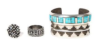 A Southwestern Style Silver and Turquoise Bracelet Length 5 5/8 x opening 1 1/8 x width 1 1/2 inches.