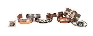 A Group of Southwestern Copper and Silver Bracelets Approximate length of each bracelet 6 1/2.