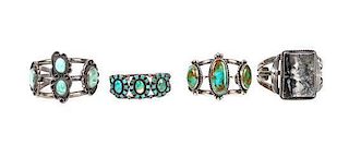 A Group of Four Southwestern Silver, Turquoise and Stone Bracelets Length of largest 5 7/8 x opening 1 x width 1 7/8 inches.