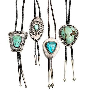 Four Southwestern Silver and Turquoise Bolos Height of first 2 1/2 x width 2 3/8 inches.