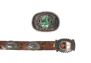 A Southwestern Concho Belt Length of first overall 41 inches, buckle 1 3/4 x 2 1/2 inches.
