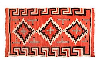 Three Navajo Transitional Rugs Largest: 77 x 50 1/2 inches.
