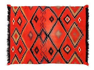 Four Navajo Germantown Weavings Largest: 48 x 35 inches.