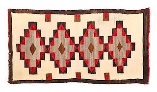 A Navajo Weaving 48 x 26 inches.