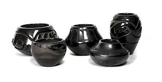 Five Pueblo Blackware Carved and Polished Pottery Articles Height of largest 3 1/2 x diameter 6 1/2 inches.