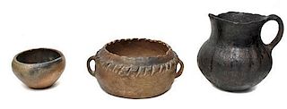 Three Pueblo Utilitarian Micaceous Clay Pottery Vessels Height of largest 3 x width 7 1/2 inches.