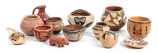 A Collection of Southwestern Pottery Articles Height of largest 4 x diameter 5 inches.