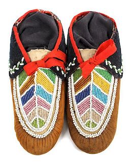 A Pair of Iroquois Moccasins Length 10 3/4 inches.