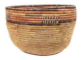 A Group of Four Southwest Style Baskets Height of largest 9 1/2 x diameter 15 inches.
