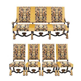 Lote de 5 piezas. Francia. Siglo XX. En talla de madera de roble. Consta de: sofá de 3 plazas y 4 sillas. Soportes con ruedas.