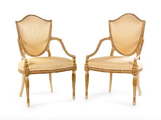 A Pair of George III Cream-Painted and Parcel Gilt Shield-Back Armchairs 