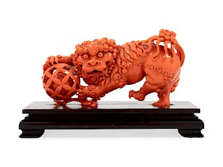 A Carved Coral Figure of a Lion