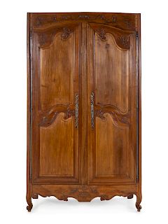 A French Provincial Walnut Armoire