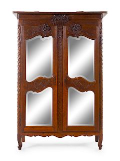 A French Provincial Carved Armoire