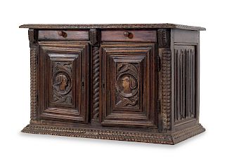 A Continental Carved Oak Cabinet