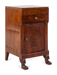 A Classical Carved and Figured Mahogany Commode Cabinet