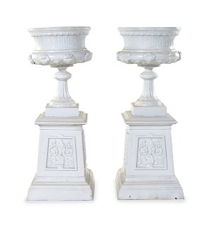A Pair of Painted Iron Garden Urns
