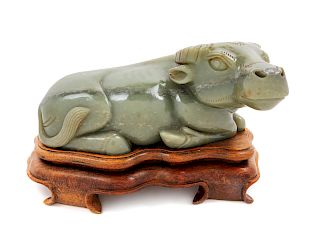 A Chinese Carved Nephrite Jade Model of a Water Buffalo and a Fitted Stand