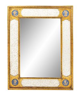A Continental Gilt Bronze and Bisque Porcelain Picture Frame
Height 18 x width 14 inches.
