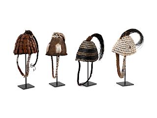 Seven Lega Headdresses and a Bamileke Quill Headdress
Height of first (with stand) 19 inches.