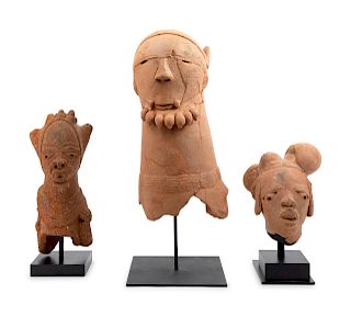 A Sokoto Earthenware Head and Two Nok Earthenware Heads
Height of Sokoto example 20 inches; height of Nok examples 11 and 16 1/2 inches.