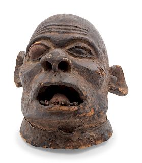 A Makonde Carved Wood Mask
Height 14 inches.