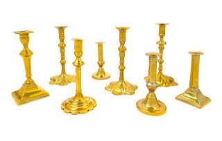 Eight English Brass Candlesticks