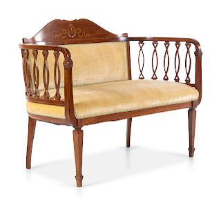 An Edwardian Style Mahogany Settee
Height 31 x width 42 1/2 inches.