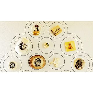 SMALL CARD OF ALASKAN SCRIMSHAW PICTORIAL BUTTONS