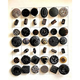 1 CARD OF BLACK GLASS BUTTONS IN ASSORTED TECHNIQUES