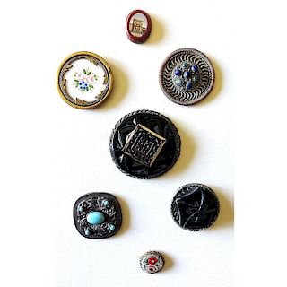SMALL CARD OF ASSORTED MATERIAL BUTTONS SET IN METAL.