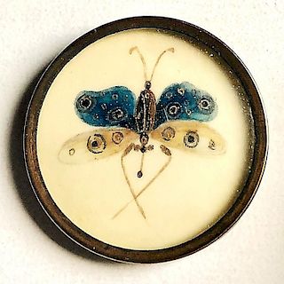 AN 18TH CENTURY BUTTON OF A BUTTERFLY UNDER GLASS