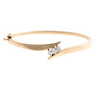 A Ladies 14K Bypass Bangle with Diamonds