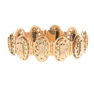 A Ladies Incan Bracelet in 18K and 14K Gold