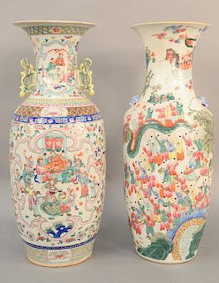 Two Famille Rose baluster vases, China, 19th/20th century, one decorated with hundred boys, dragons and lion handles, and the other with the Daoist Ei