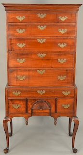 Queen Anne cherry highboy in two parts, upper portion with cornice molded top over five drawers set on base with two long drawers all set on cabriole 