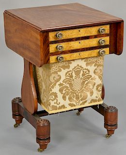 Empire mahogany stand, having drop leaves and three figured maple drawer fronts, including one bag drawer, circa 1830. height 27 inches, top: 20" x 32
